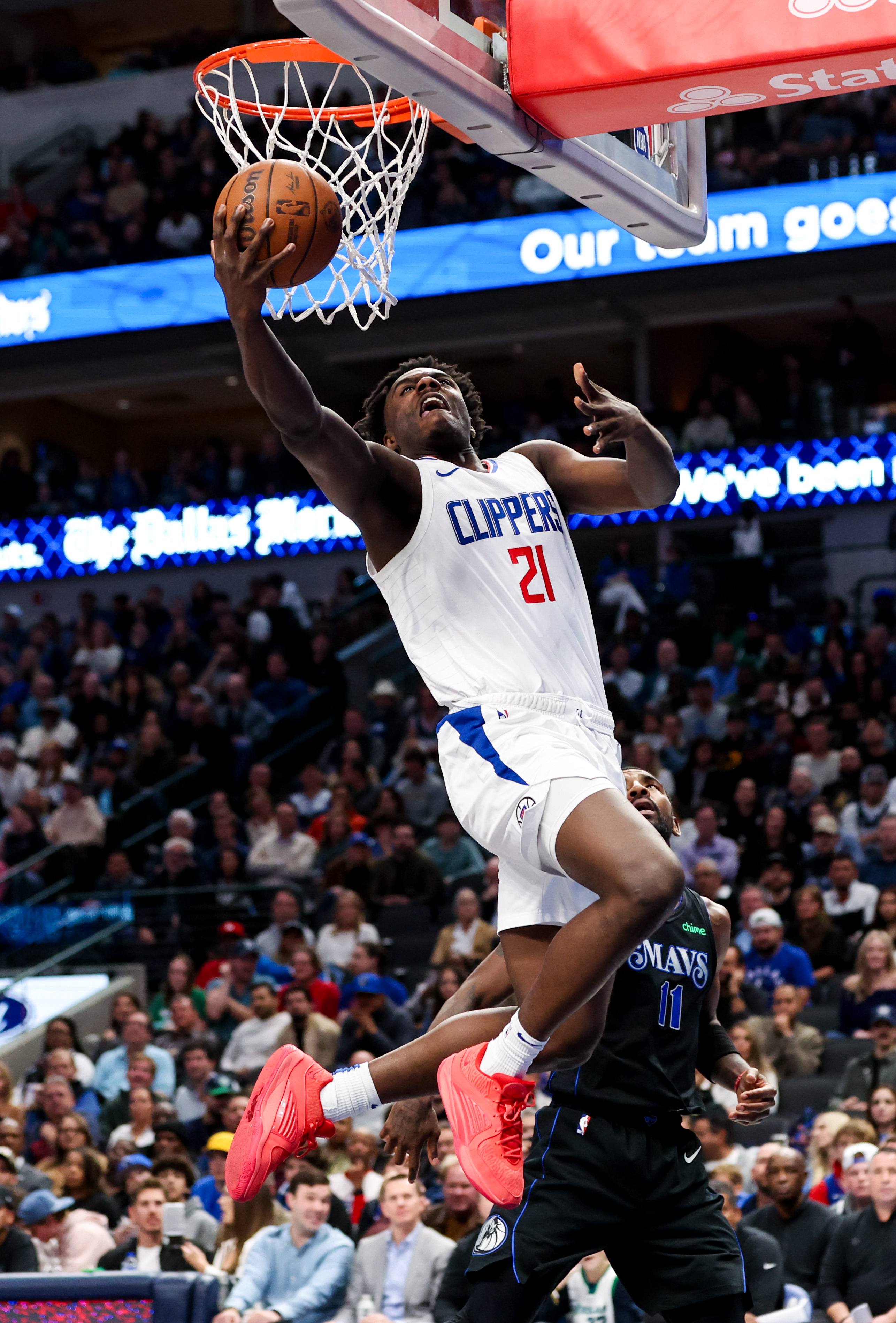 Nov 10, 2023; Dallas, Texas, USA; LA Clippers guard Kobe Brown (21) shoots during the second half against the Dallas Mavericks at American Airlines Center.
